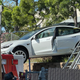 Image for article titled A Tesla Model 3 Crashed And Landed On Top Of An Ambulance